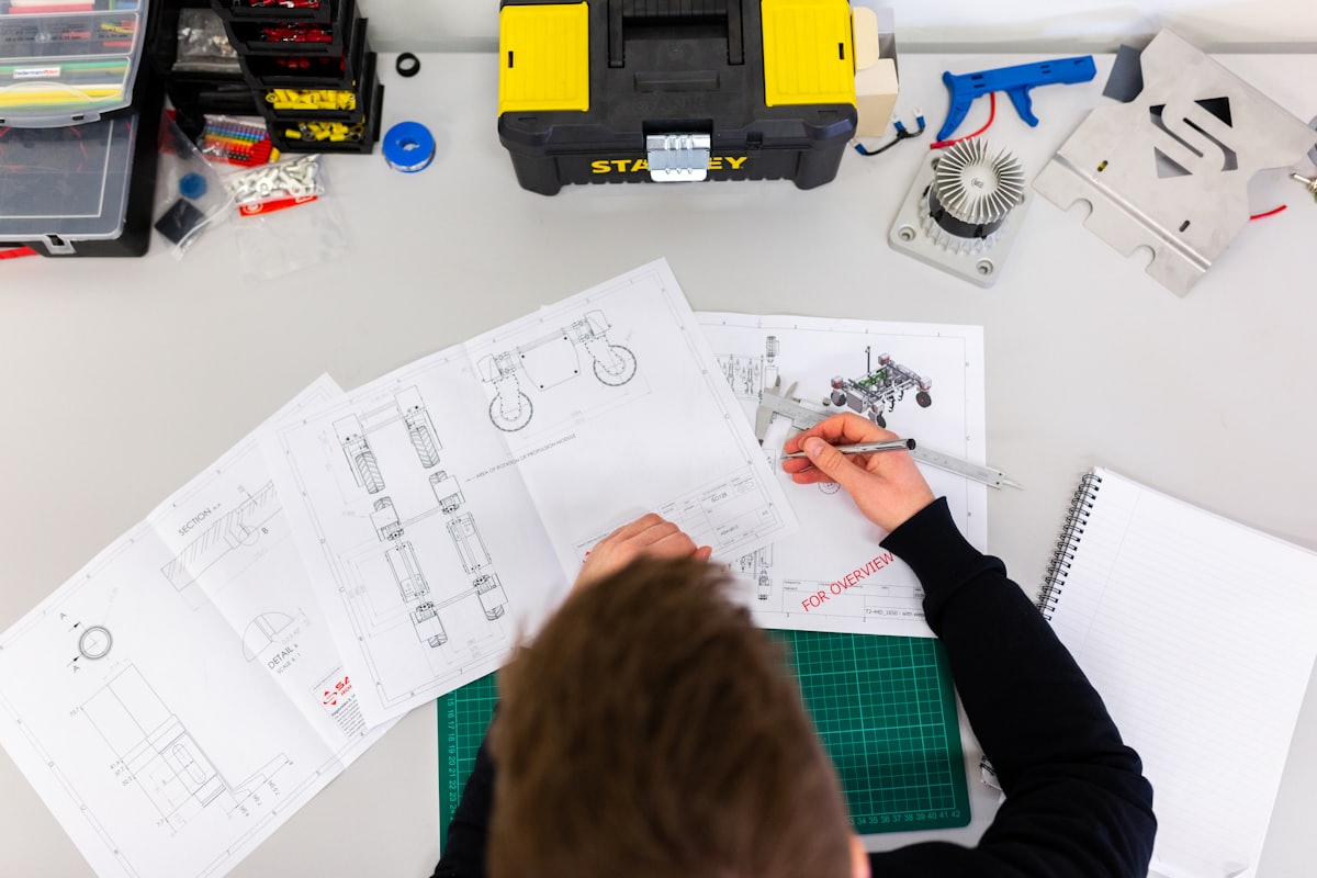 Engineer with tablet inspecting industrial equipment