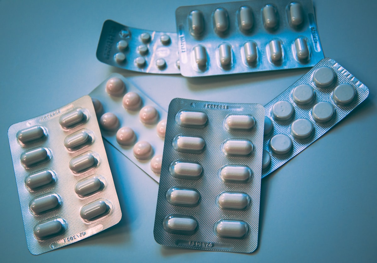 Packaged medicine bottles and pills